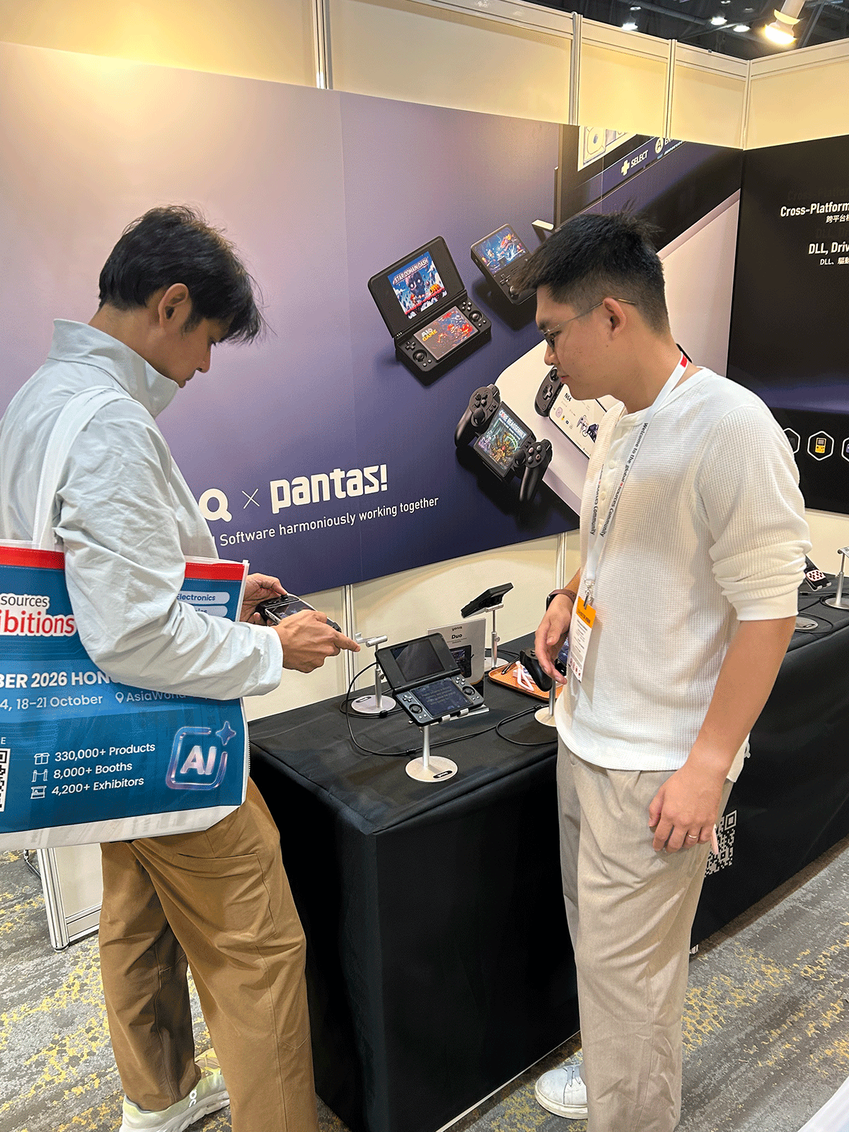 A visitor testing Yoniq gaming hardware at the booth